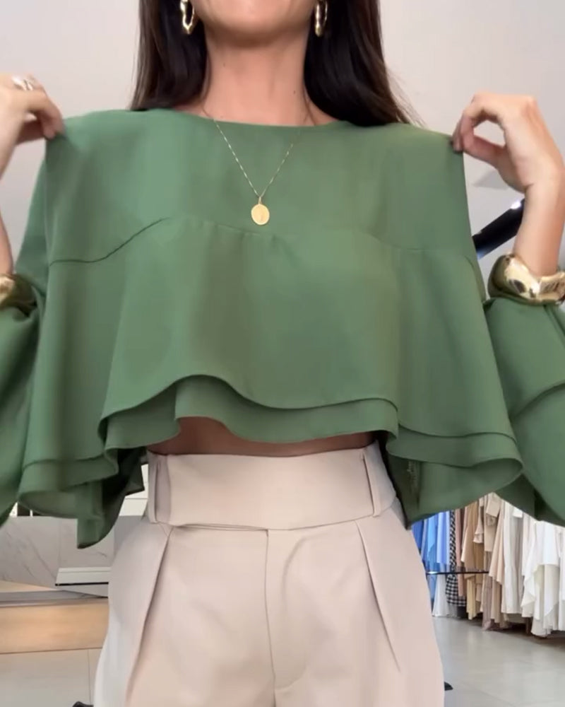 Blusa con doppia manica a sbuffo